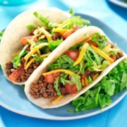 A plate of food on a table, with Taco and Beef