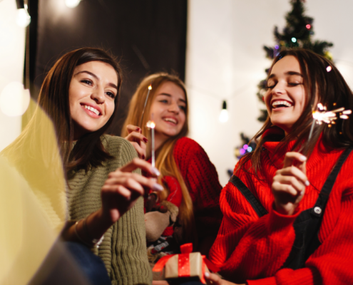 three teen girls celebrating Christmas together