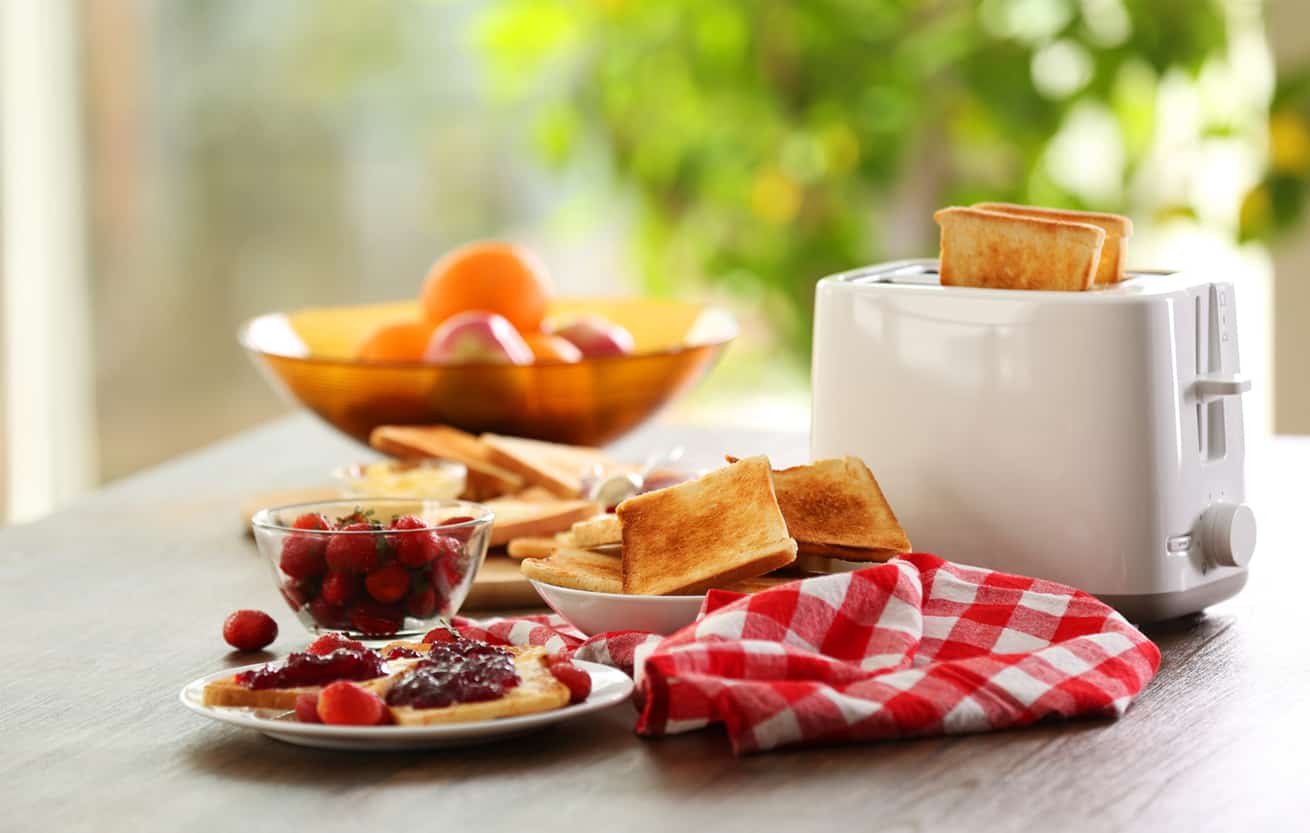 Best inexpensive toaster serving up breakfast with toast and fruit, on blurred background