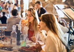 two women eating in a restaurant