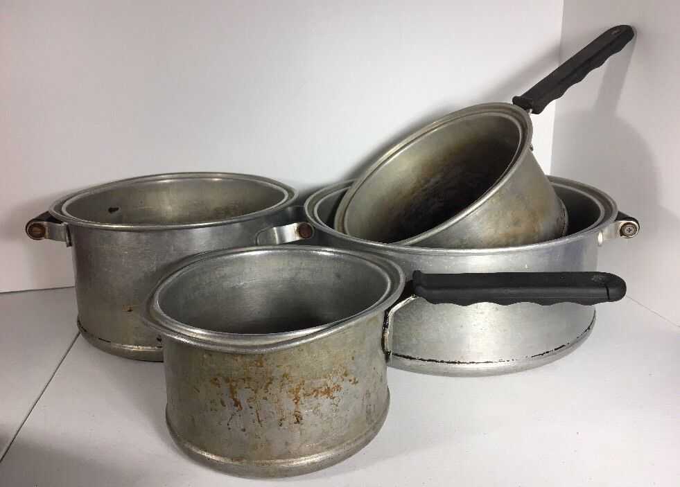 vintage aluminum cookware with stains from dishwasher