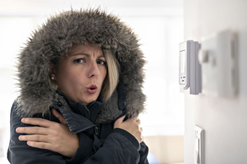 A Woman With Warm Clothing Feeling The Cold Inside House