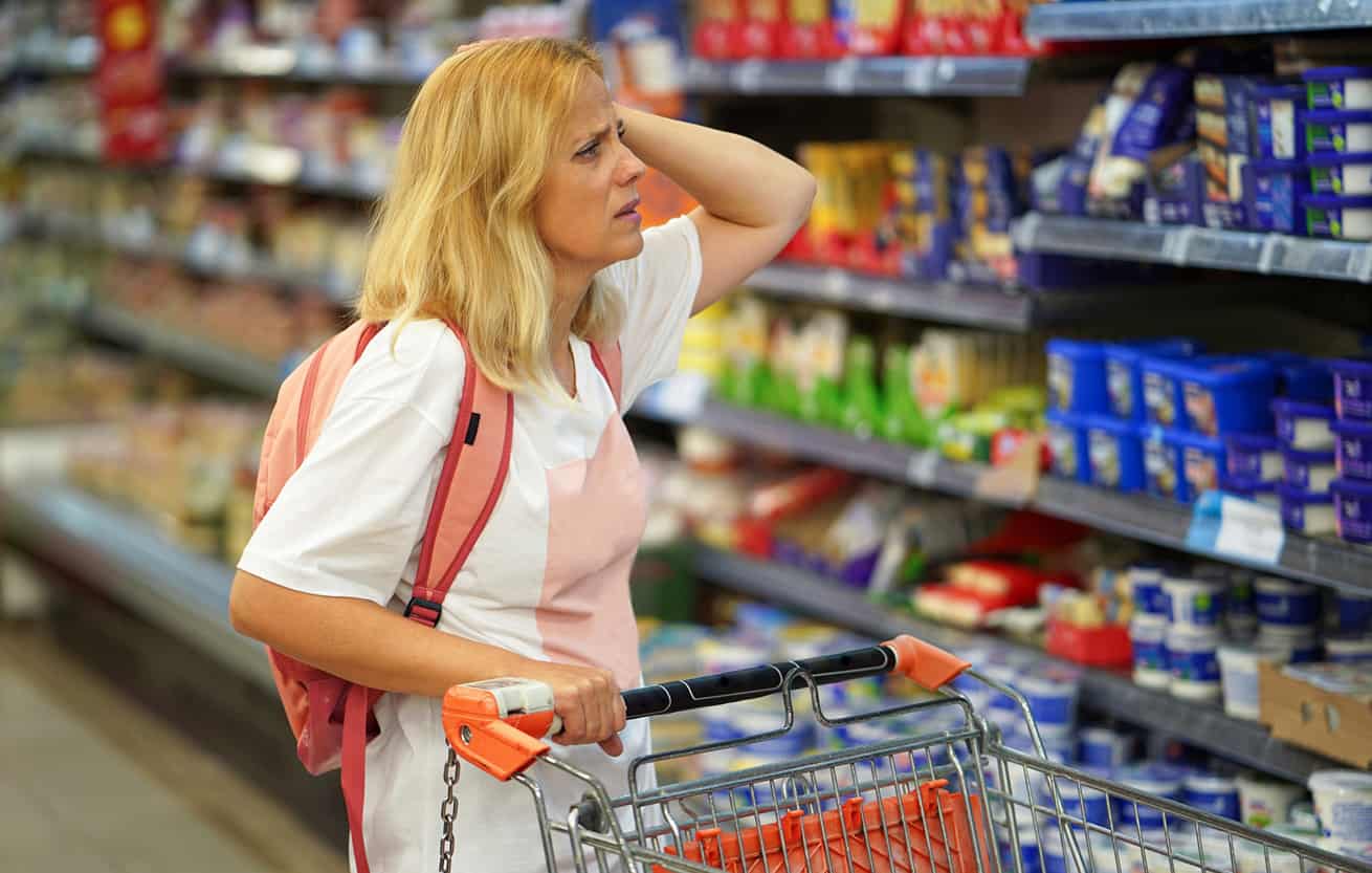 woman food shopping stressed